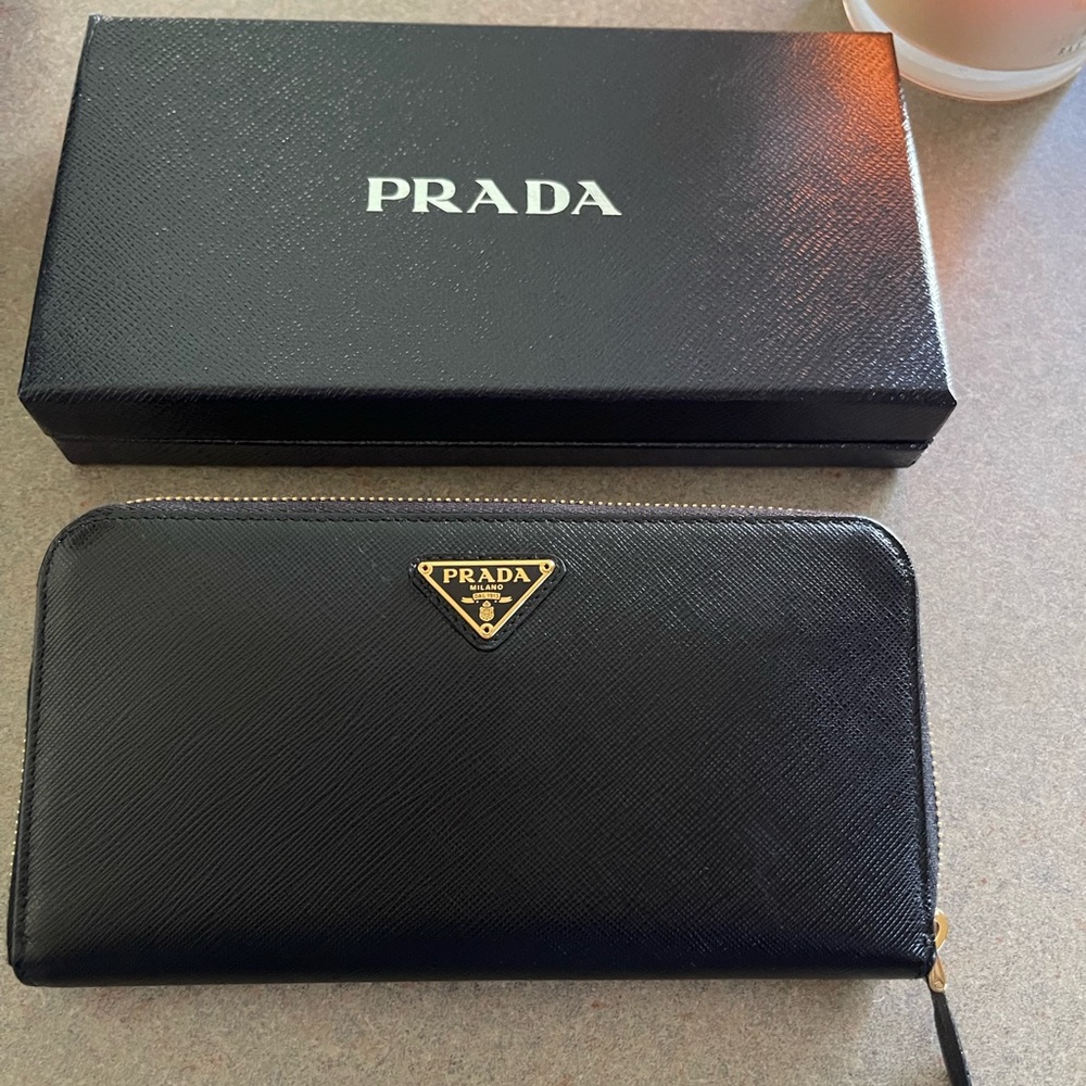 Prada wallet brand new in box have authenticity cards.